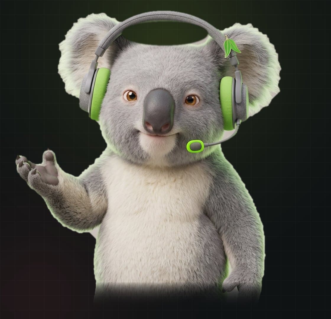 Wattle, the Kind Creators Australia and New Zealand host: a silver-grey koala in a podcast headset with a lime boom mic and a gum-leaf pin, one paw raised in welcome.
